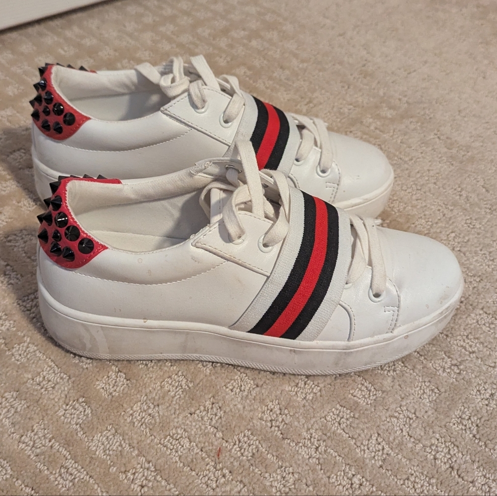 Stylish White Sneakers with Red and Black Accents